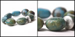 <span style='font-size: 12px;'>Silver and Turquoise Oval Bead Bracelet</span>